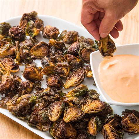 Heat the olive oil in nonstick skillet over medium heat. Fried Brussels Sprouts with Sriracha Dipping Sauce | Cook's Country