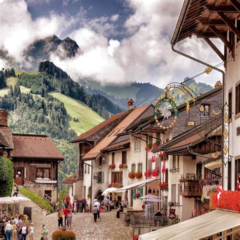 Swiss Alps And Medieval Town Of Gruyères In The Fribourg Canton