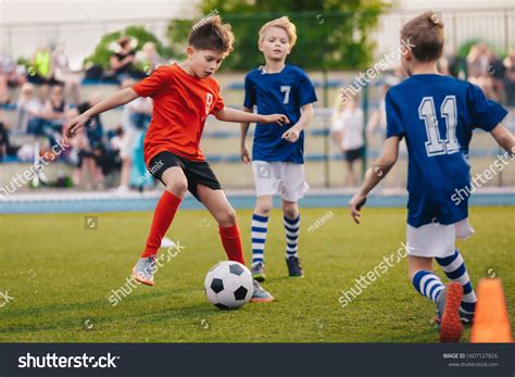 Young Boys Playing Soccer Game Training Stock Photo 1607127826