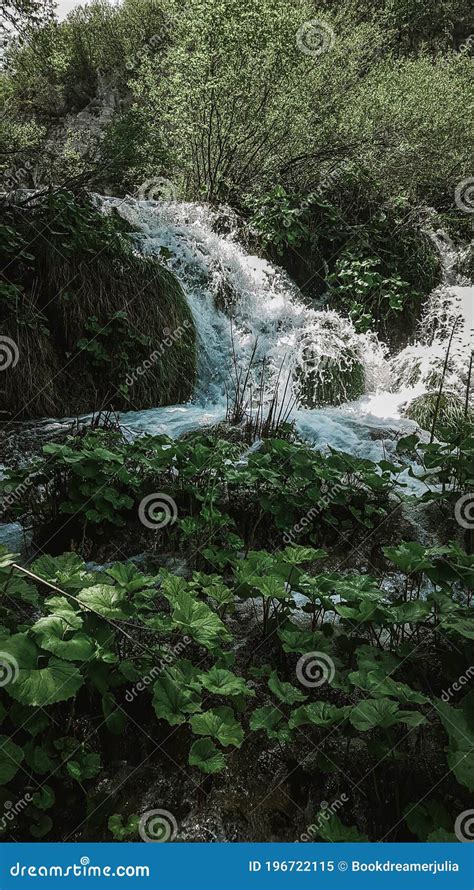 Beautiful Waterfall From Croatian Plitvice Lakes Surrounded By Greenery