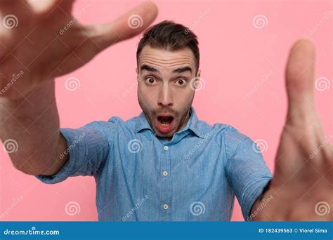 Casual Man Is Reaching Out To The Camera Is Shocked Stock Image