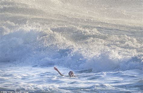 Terrifying Moment A Drowning Swimmer Is Plucked From The Surf By Hero