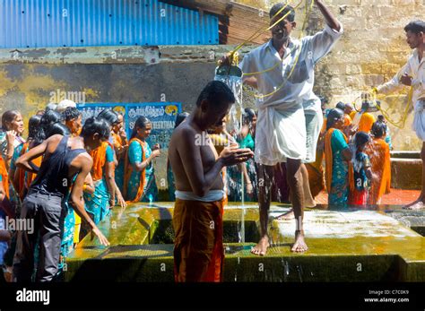 Hindu Pilgrims Receiving The Holy Bath At The Ramanathaswamy Temple In