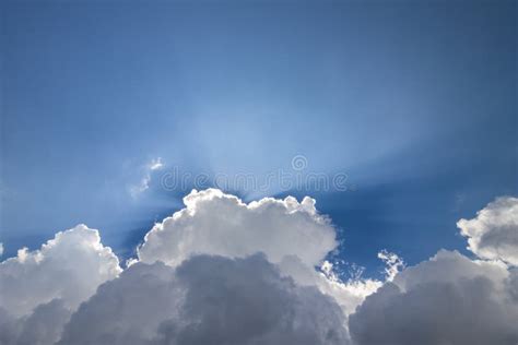 Blue Sky With Puffy White Clouds In Bright Clear Sunny Day Stock Photo