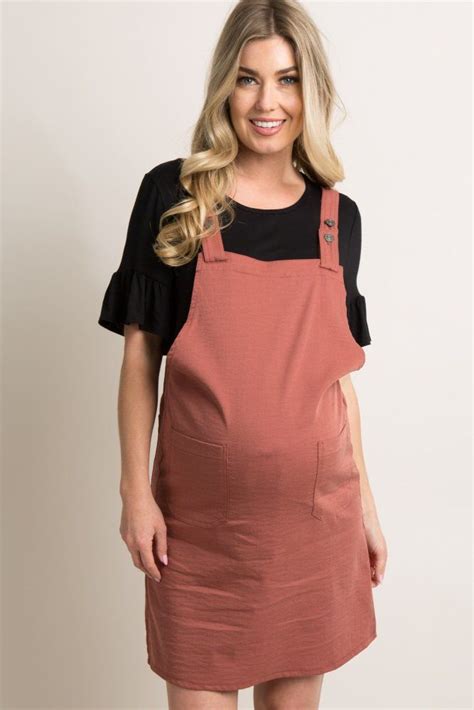 A Textured Maternity Overall Dress Featuring A Square Neckline