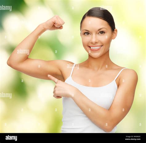 Picture Of Beautiful Sporty Woman Flexing Her Biceps Stock Photo Alamy