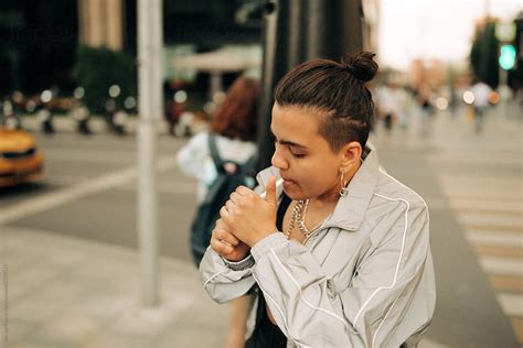 Lesbian Woman Smoking On The Street Del Colaborador De Stocksy