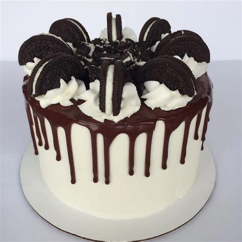 oreo drip cake chocolate cake filled with vanilla buttercream and topped with chocolate