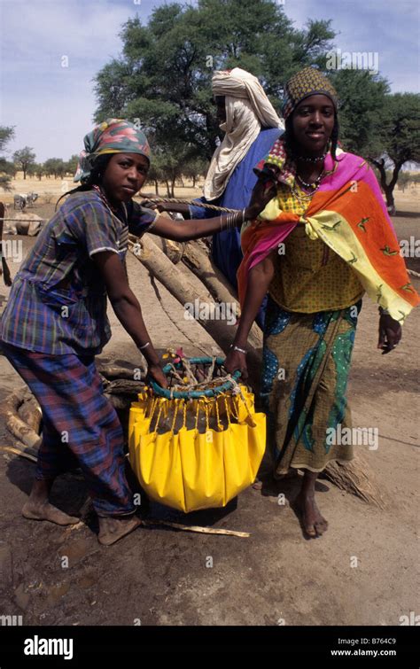 Akadaney Niger West Africa Fulani Women Carrying Water From Well To