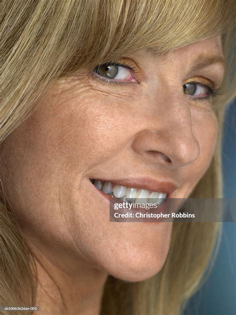 Mature Woman Smiling Portrait Closeup High Res Stock Photo Getty Images