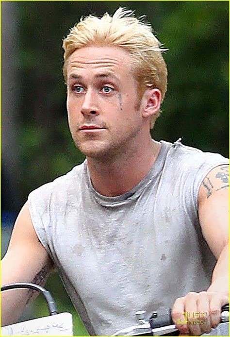 Ryan Gosling Shows His Wild Side With Bleach Blond Hair And Tattoos Riding A Motorbike Around