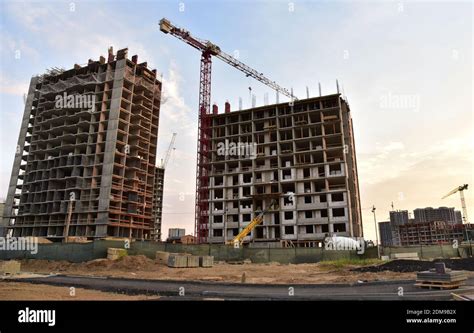 Preparing To Pour A Bucket Of Concrete Into Formworktower Crane