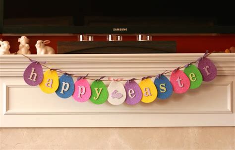 A Happy Easter Banner Hanging From A Fireplace Mantel