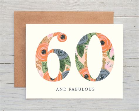 A Card With The Number Sixty And Flowers On It