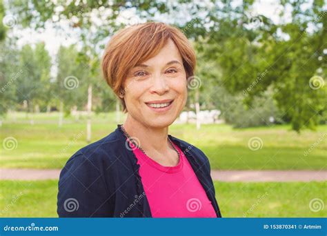 Closeup Portrait Of Healthy Smiling Older Woman Outdoors Elegant Mature Redhead Woman With