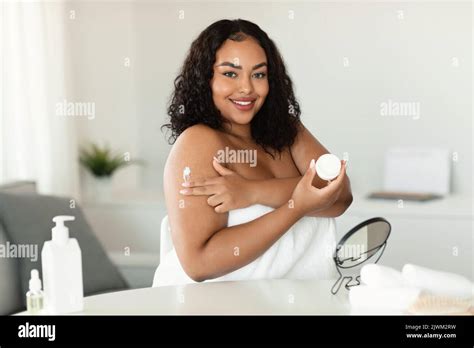 Skin Care Pretty Bodypositive Woman Applying Moisturising Body Lotion After Bath Standing With