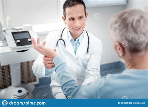 Positive Delighted Medical Worker Checking Pulse Stock Photo Image Of