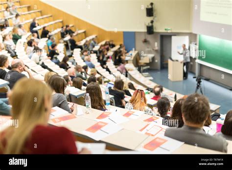 Audience In The Lecture Hall Female Student Making Notes Stock Photo