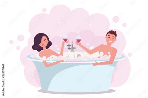 Couple In Bath Enjoying Drinking Red Wine Young Man And Woman