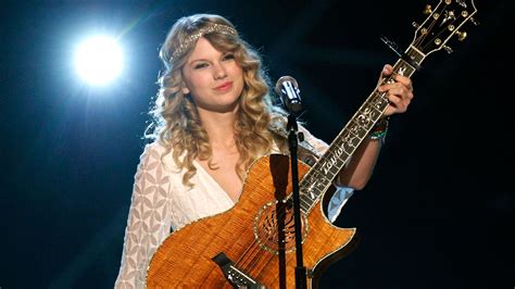 Taylor Swift Receives One Of Her First Guitars In “christmas Tree Farm