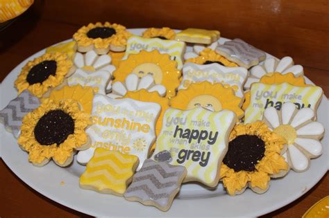 Your guests will love this unique party theme while enjoying a special photo booth filled with sunshine themed photo props. You Are My Sunshine baby shower cookies by The Sweet ...