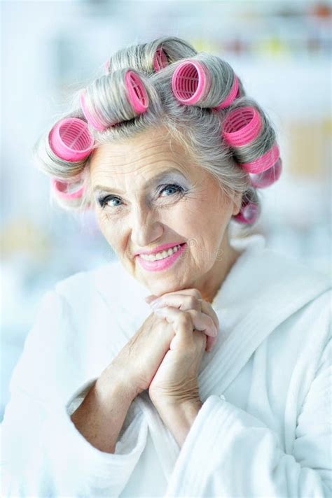 senior woman in hair rollers stock image image of face looking 74811625
