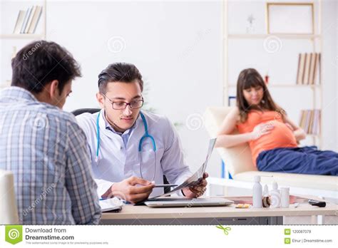 The Pregnant Woman With Her Husband Visiting The Doctor In Clinic Stock Image Image Of Case