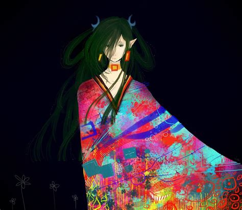 A Woman With Long Black Hair Wearing A Colorful Kimono