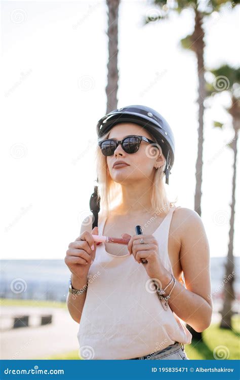 Bike Helmet Woman Putting Biking Helmet On Outside During Bicycle Ride Stock Image Image Of