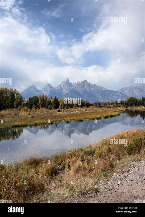 The Teton Mountains Reflected In The Water Of The Snake River At