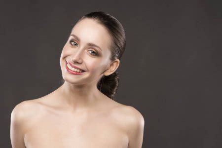The Beautiful Girl Naked Shoulders Portrait On A Gray Background Stock Photo By Alextorb