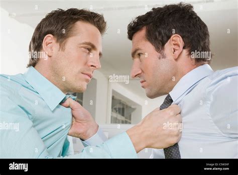 Germany Munich Two Business Men Fighting In Office Close Up Stock