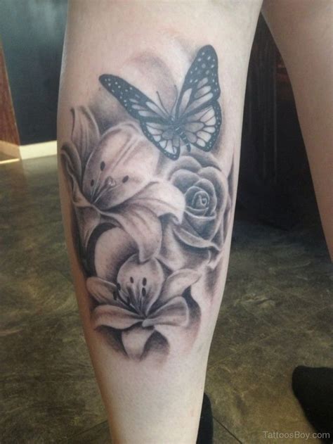 Realistic Butterfly And Flowers Tattoo On Back Leg Idées De Tatouages Tatouage De Papillon