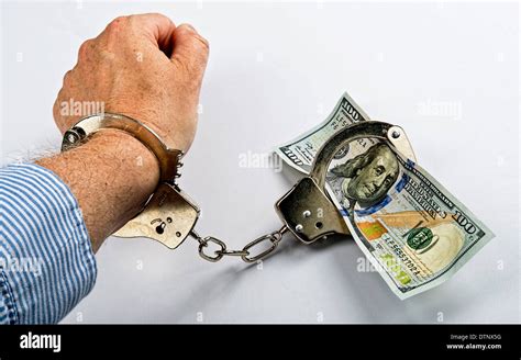 Man Made Prisoner To Cold Hard Cash Stock Photo Alamy