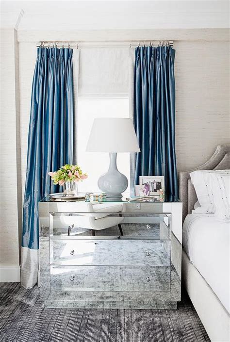 Here again in the bedroom below, the thin, dark coloured rods are repeated in the canopy bed and the bedroom accent furniture. Blue and Gray Curtains - Transitional - Bedroom