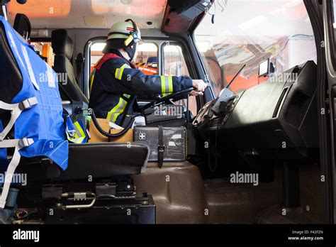 Firefighter Driving A Used Fire Truck Stock Photo Alamy