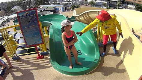 Boomerang and superbowl, a six level wave pool or even an aqua play pool for the children can give you an unforgettable fun moment. Small Lady on the Green Tube Water Slide at Splash Jungle ...
