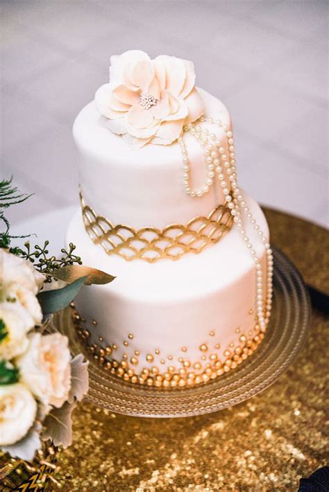 It's a chocolate cake, painted with chambord, with raspberry buttercream filling. Glam Gatsby Inspired Wedding in Perth | Wedding cake pearls, 1920s wedding cake, Wedding cakes