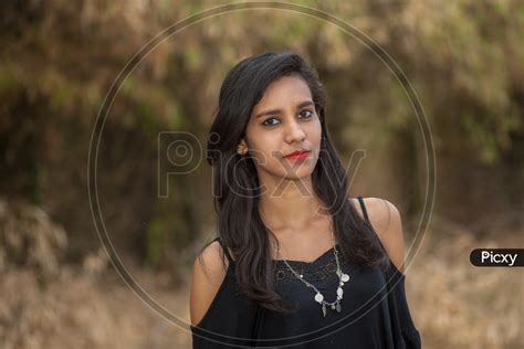 Image Of Young Indian Girl Posing Outdoor With Nature Background Kh648269 Picxy
