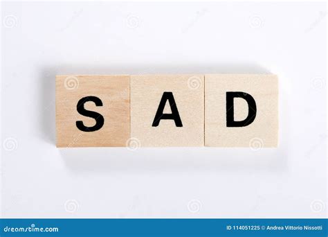 Word Sad Made Of Wooden Blocks Isolated On White Background Stock Image