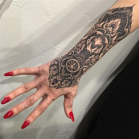 Hand To Forearm Tattoos