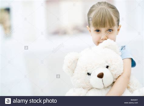 Little Girl Holding Teddy Bear Portrait Stock Photo Alamy