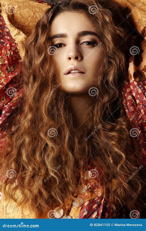 Brunette Girl With Long And Shiny Wavy Hair Beautiful Model With Curly Hairstyle Stock Image