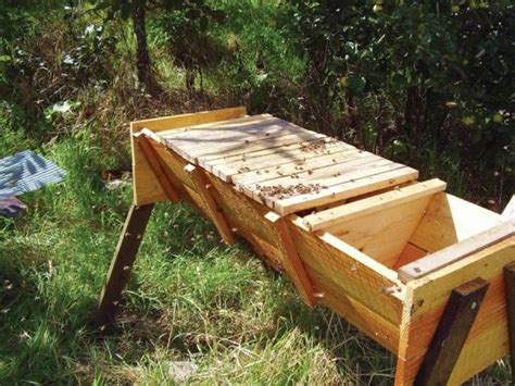 Teenage beekeeper checking hives on bee yard. Keeping Bees: Using the Top-Bar Beekeeping Method ...