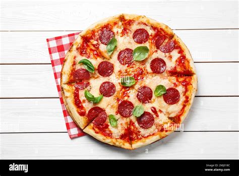 Hot Delicious Pepperoni Pizza On White Wooden Table Top View Stock Photo Alamy