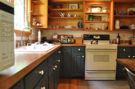 Get inspired by our article. Two tone kitchen - dark blue base cabinets and natural ...