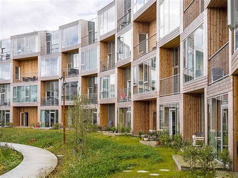 Bigs Modular Housing Spirals Around Central Pond In Denmark