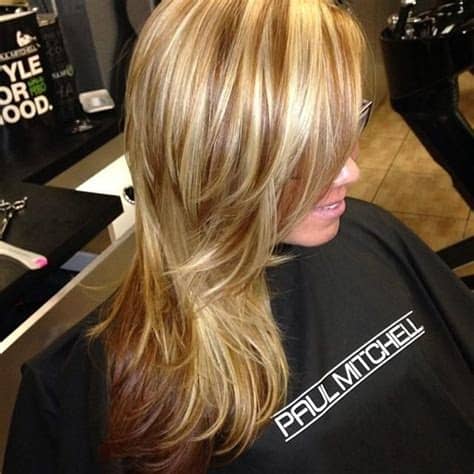 Darker caramel colored lowlights peak subtly through waves of lighter platinum blonde highlights. Dark Blonde Hair with Caramel Lowlights | Hair highlights ...