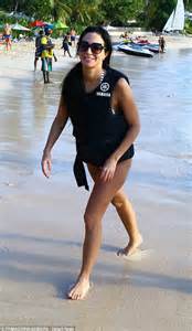 tulisa contostavlos displays her trim figure in black and gold chain bikini on the beach in