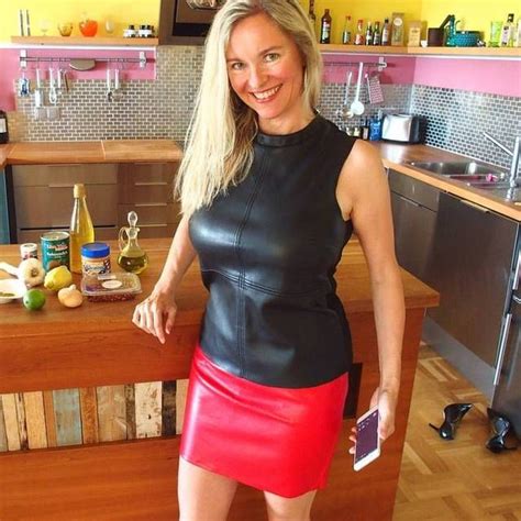 Amateur Mature Blonde At Home In Kitchen Wearing Black Leather